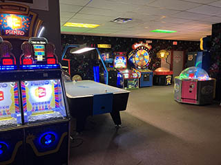 Melody Gardens Skateland game machines including Plinko and air hockey